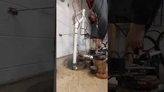 Installing a sump pump bin a flooded basement.  #plumbing #basement #homeimprovement
