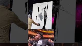 Why Is This Artist Throwing Paint Everywhere?